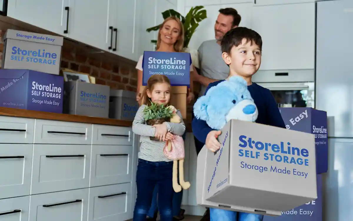 People packing Storeline Storage boxes